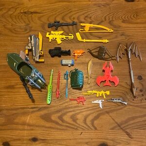 Random OG lot of action figure weapons and accessories.